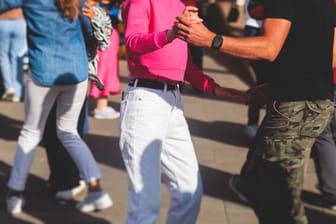 Couples dancing traditional latin argentinian dance milonga outdoor in the city streets, tango salsa bachata kizomba lesson, outdoors dance school class festival in a summer sunny day