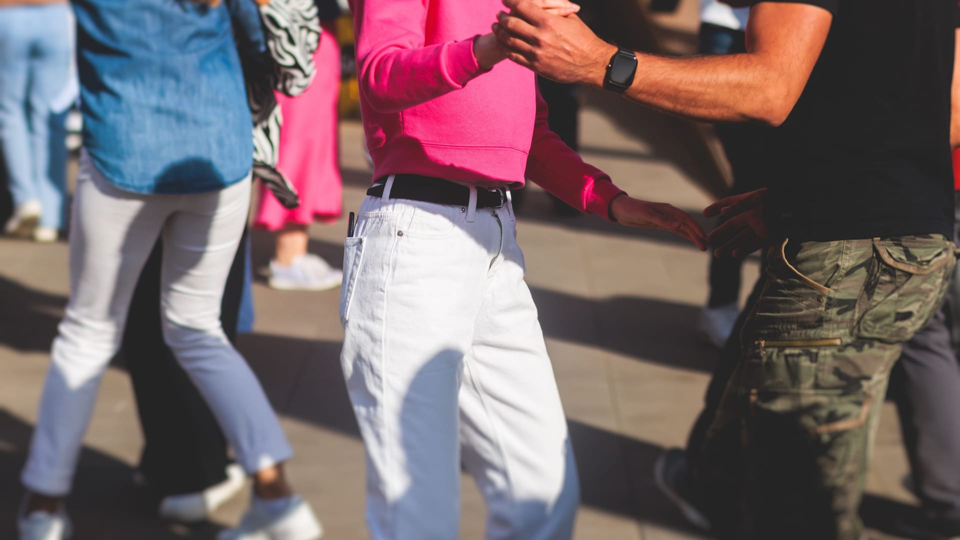 Couples dancing traditional latin argentinian dance milonga outdoor in the city streets, tango salsa bachata kizomba lesson, outdoors dance school class festival in a summer sunny day