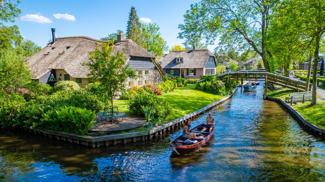 Giethoorn Netherlands tourist visit the village with wooden boat ,view of famous village with canals