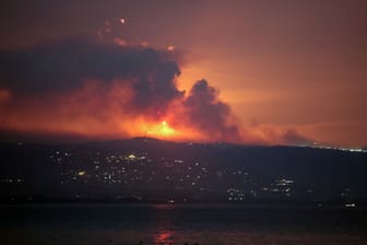 A view shows smoke and fire on the Lebanese side of the border with Israel, as seen from Tyre, southern Lebanon