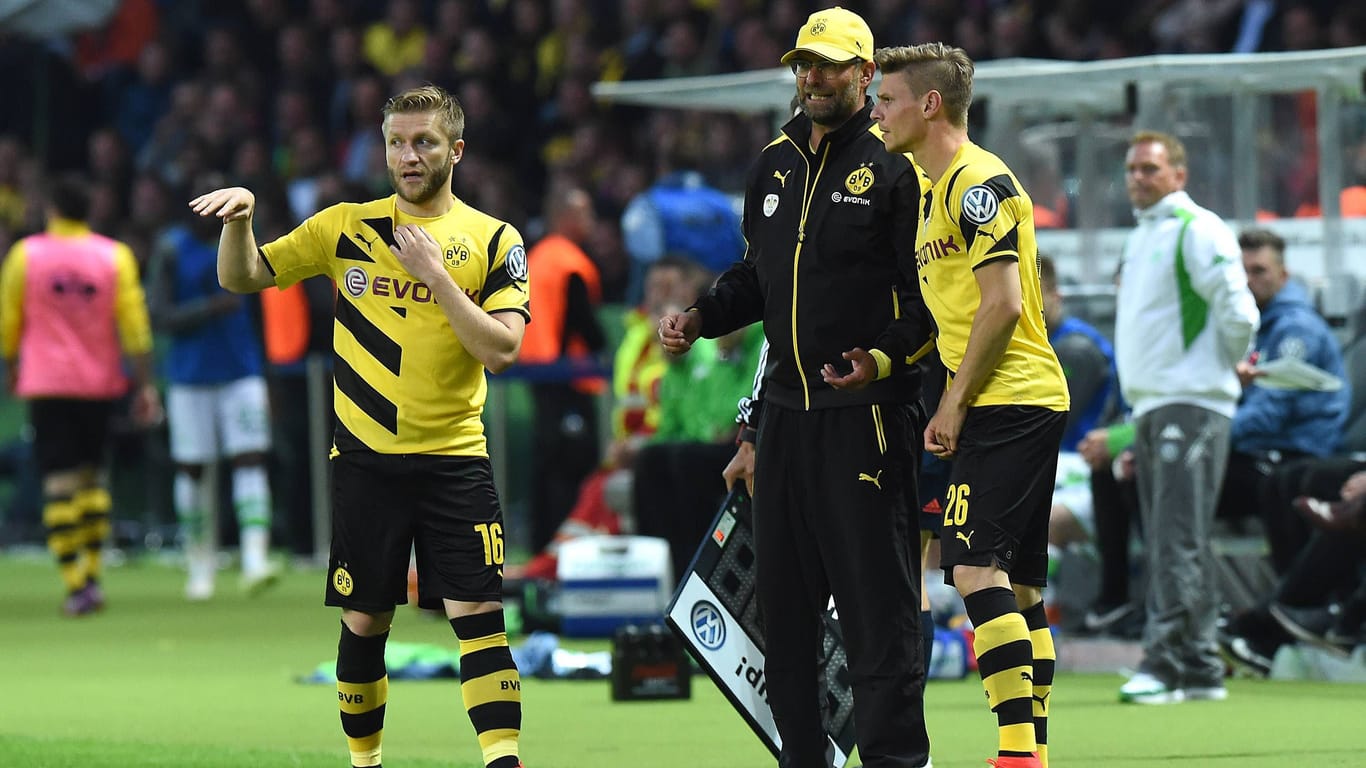 Jürgen Klopp gemeinsam mit Jakub Błaszczykowski (l.) und Łukasz Piszczek (r.): Für das Abschiedsspiel der beiden kehrt der Trainer zurück nach Dortmund.