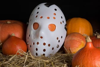 Pumpkins in straw with a Janson mask