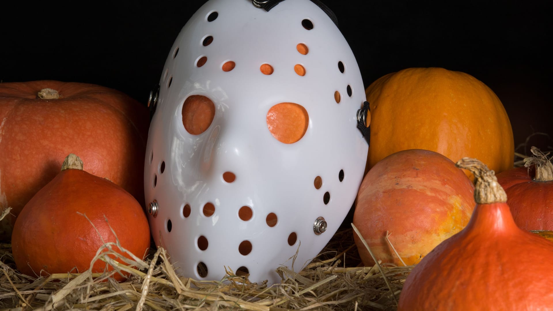 Pumpkins in straw with a Janson mask