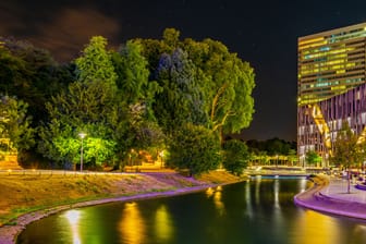 Night view of an illuminated channel in Hofgarten in Dusseldorf, Germany