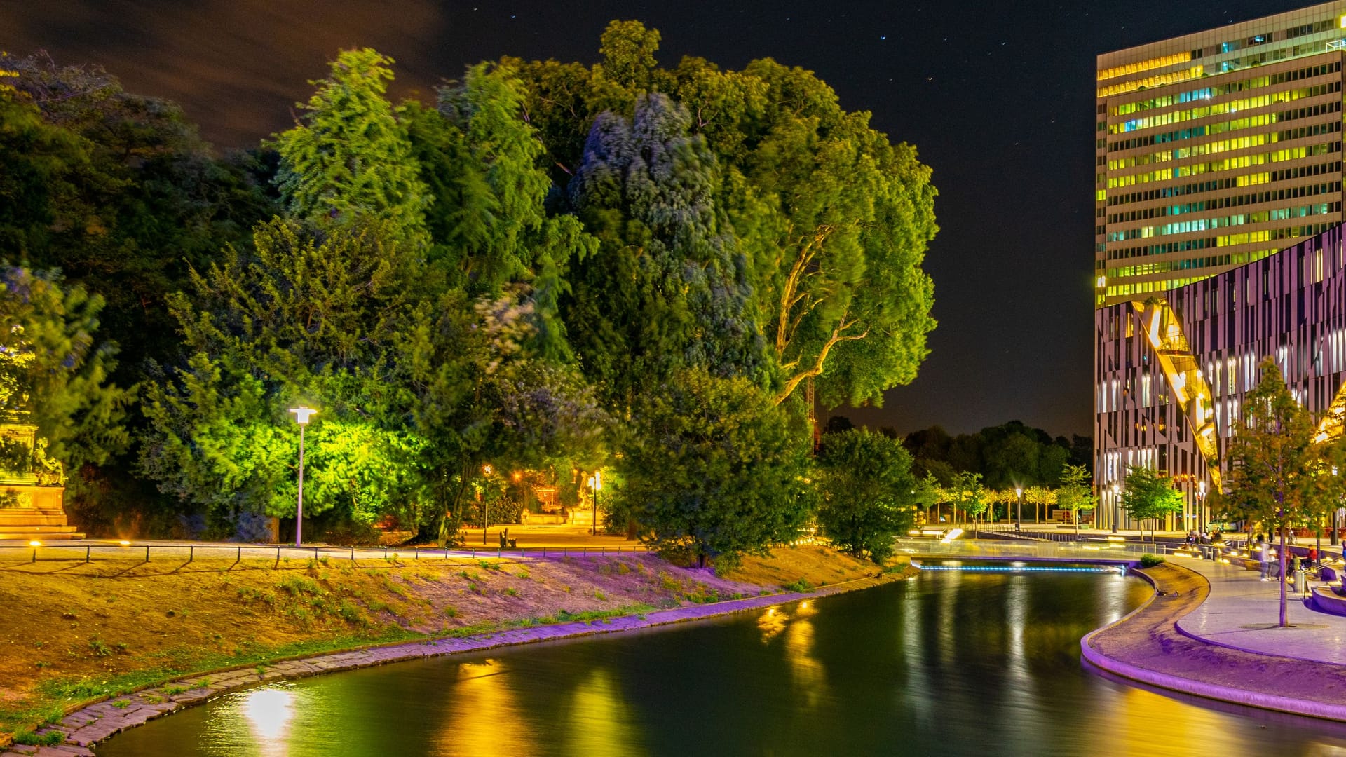 Night view of an illuminated channel in Hofgarten in Dusseldorf, Germany