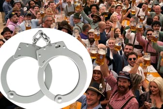 Feiernde auf dem Oktoberfest (Symbolfoto): Die Feuerwehr musste ein Paar Handschellen lösen.