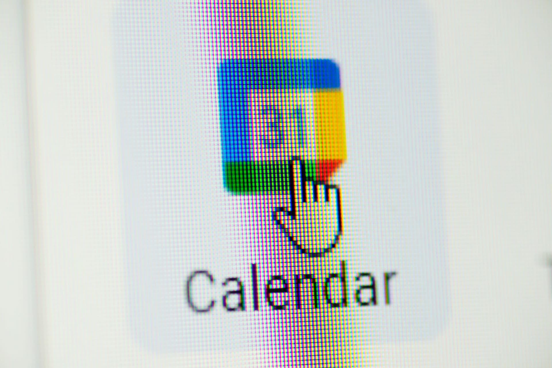 Macro shot of cursor of mouse on Google Calendar icon. Chernihiv, Ukraine - January 15, 2022