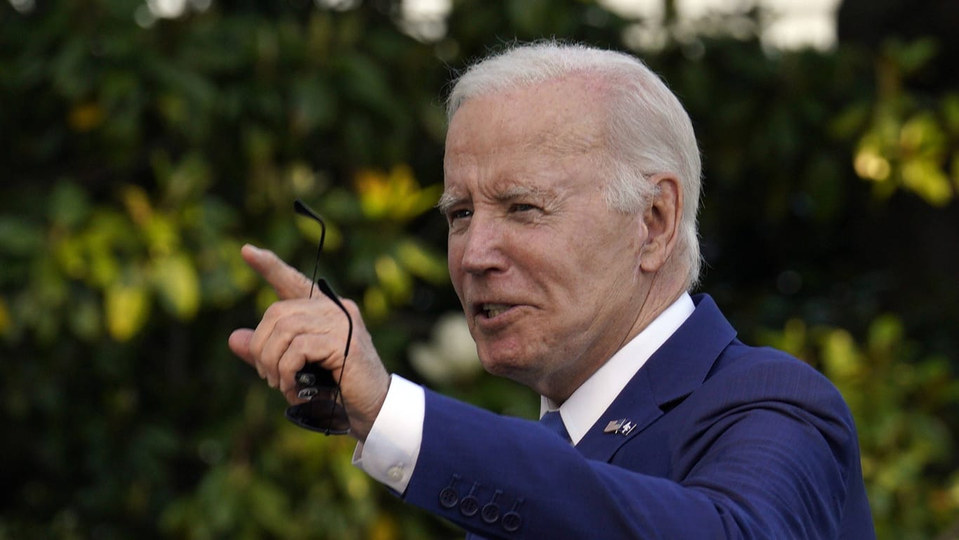 President Joe Biden walks on the South Lawn of the White House upon his return from Colorado.