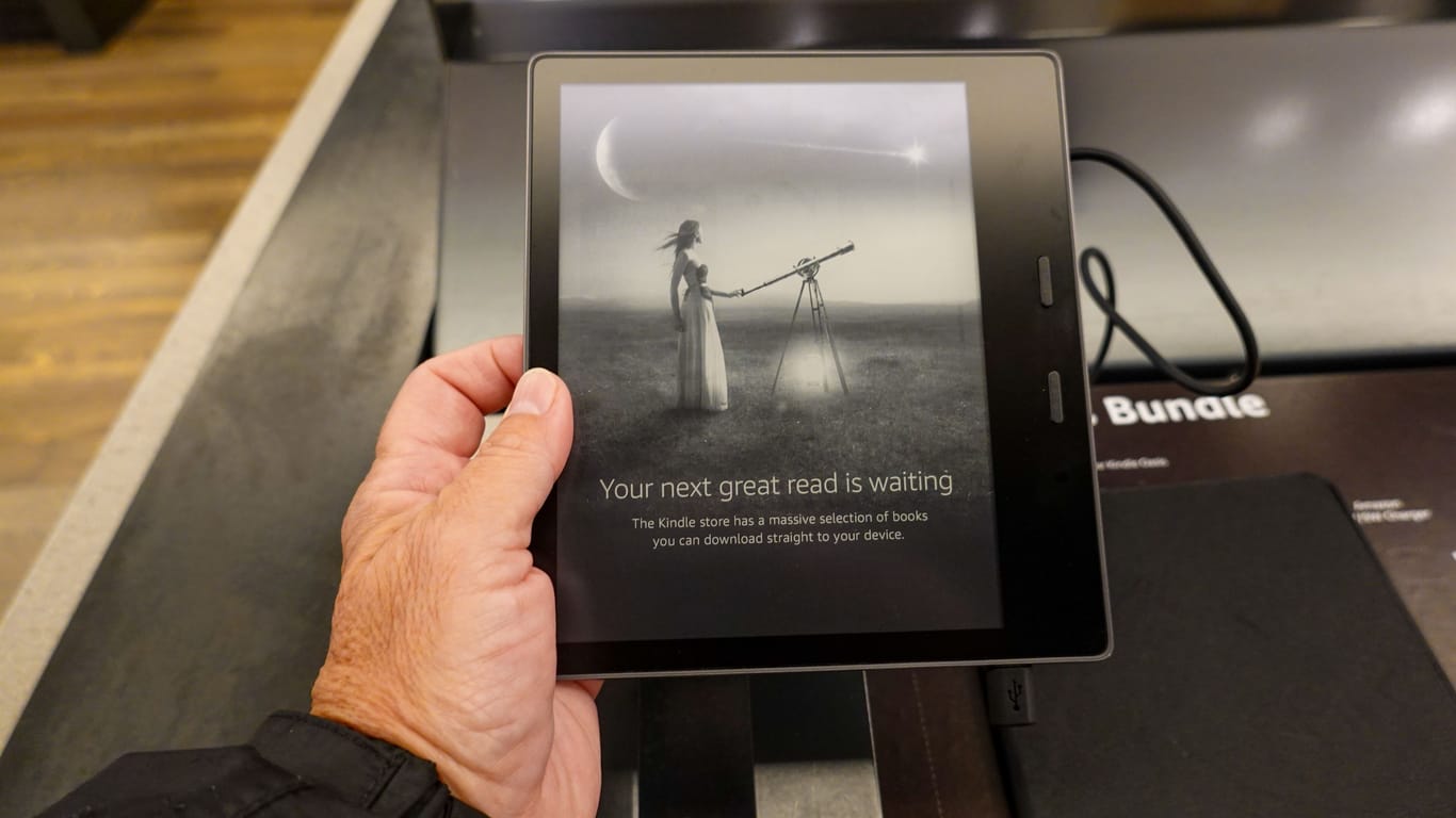 An Amazon Kindle Paperwhite device on sale at an Amazon Book Store.