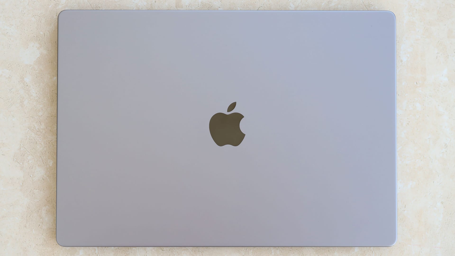 KYIV, UKRAINE - 4 MAY, 2023: Cover view of MacBook Air MacBook Pro 13 in space gray color isolated on white background