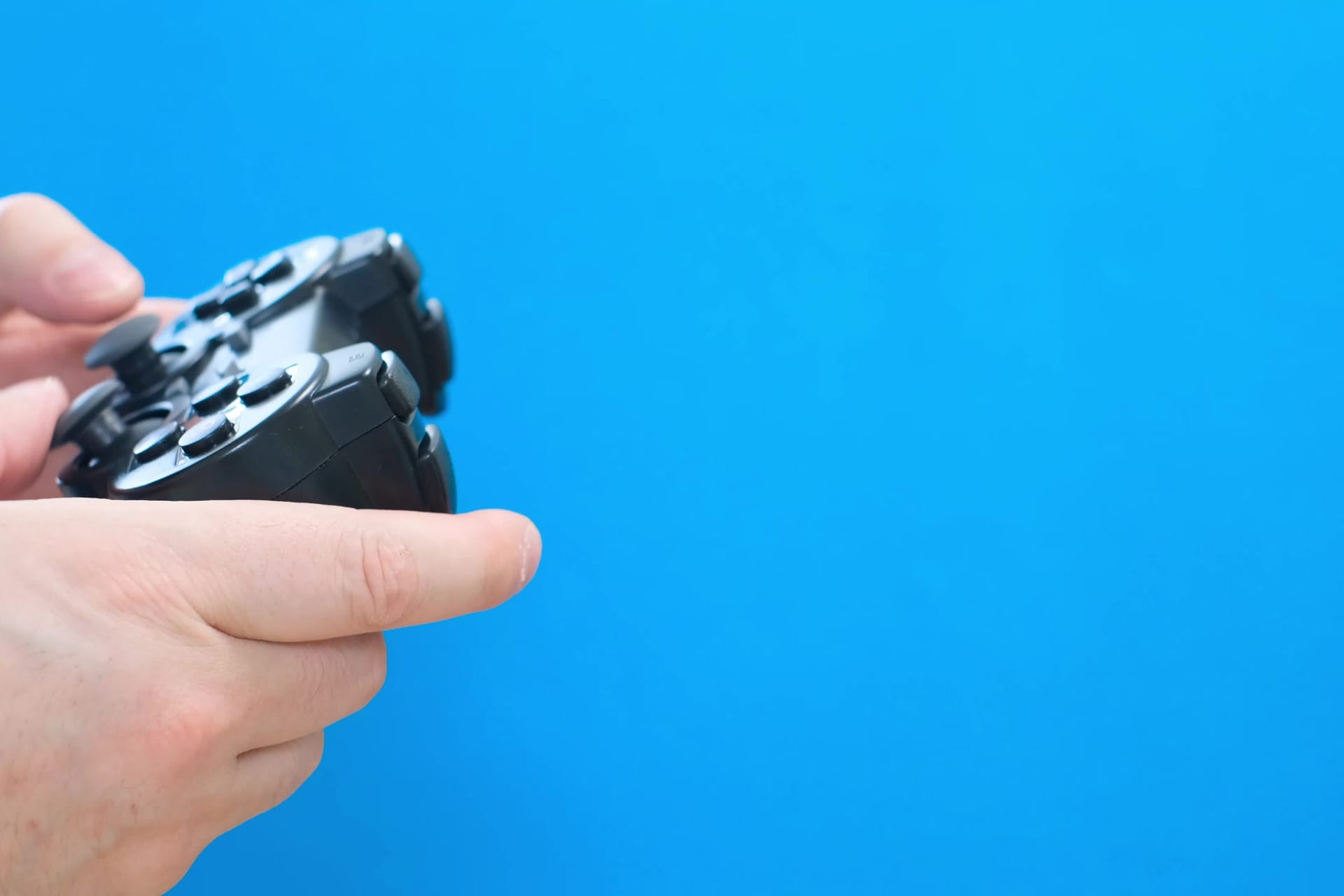 Modern game controller isolated on white blue background