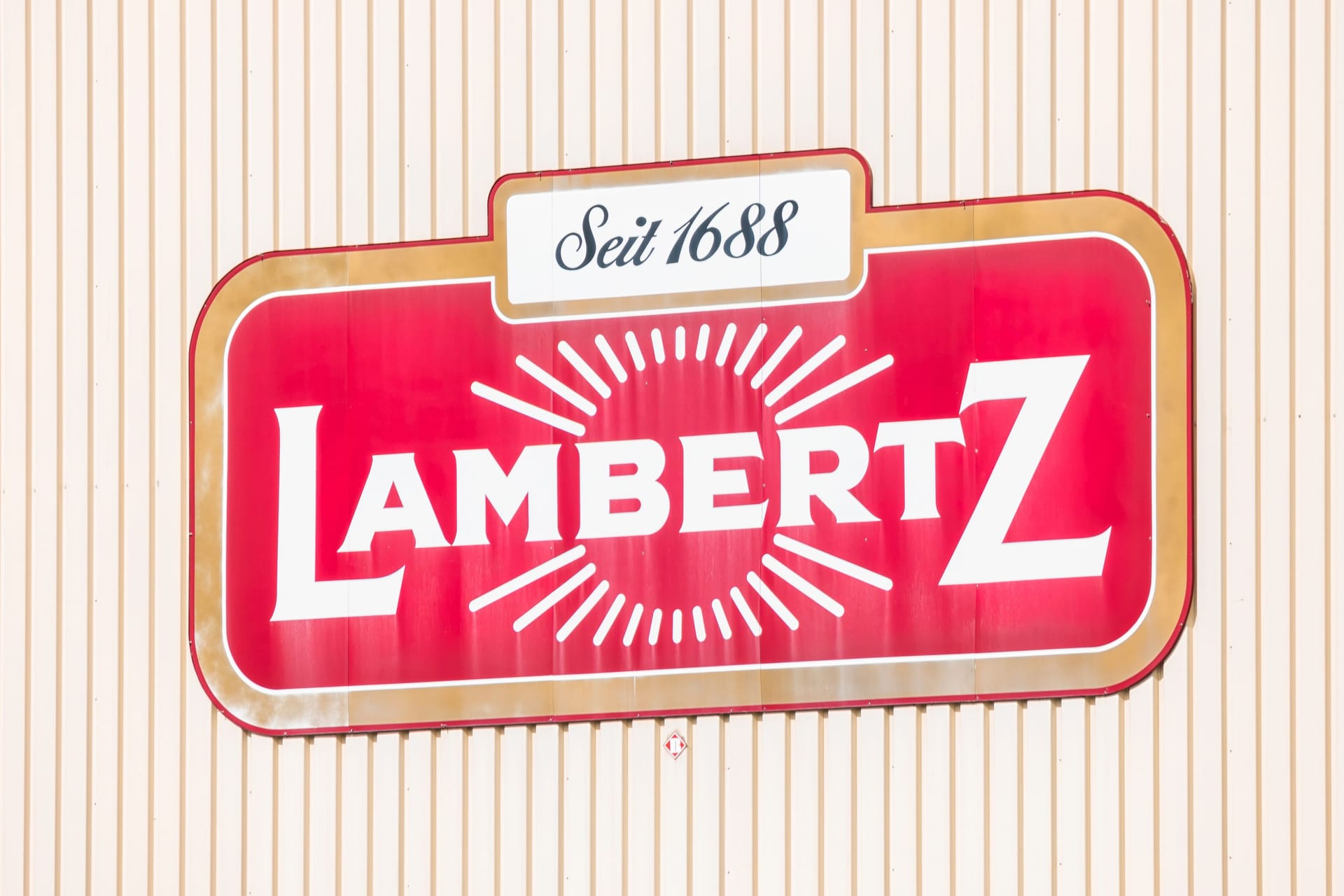 AACHEN, GERMANY OCTOBER, 2017: Lambertz Logo on a factory building. The Lambertz Group is a Aachener Printen- and chocolate factory founded by Henry Lambertz 1688 and a manufacturer Christmas cookies.