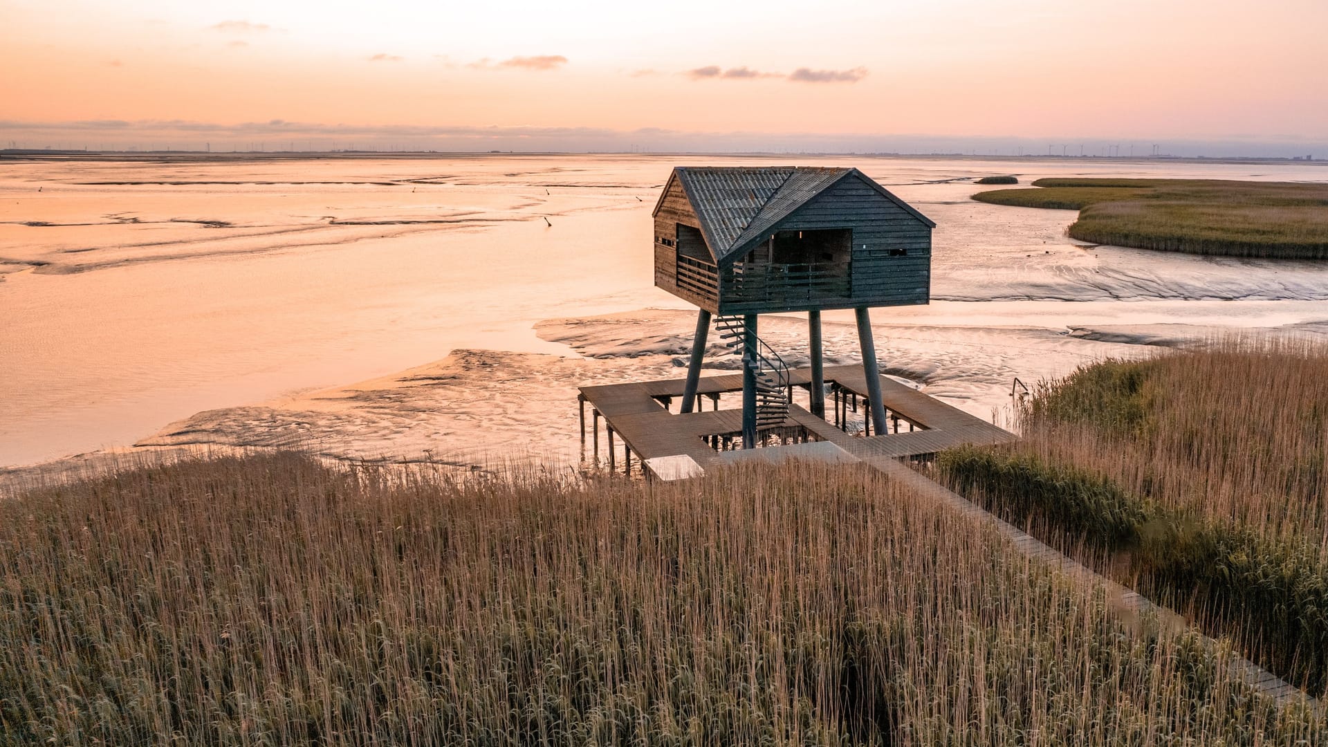 Sunset photo of Kiekkaaste Bird Observatory in The Netherlands at Wadden Sea