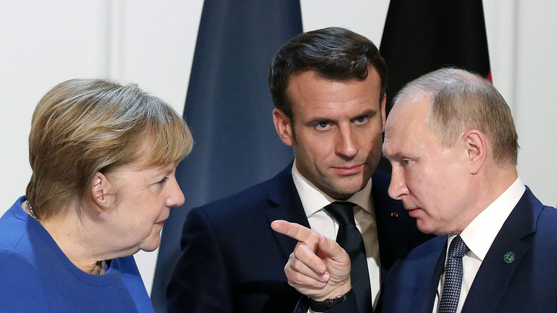 Putin (r.), Merkel und Frankreichs Präsident Emmanuel Macron im Jahr 2019 in Paris.