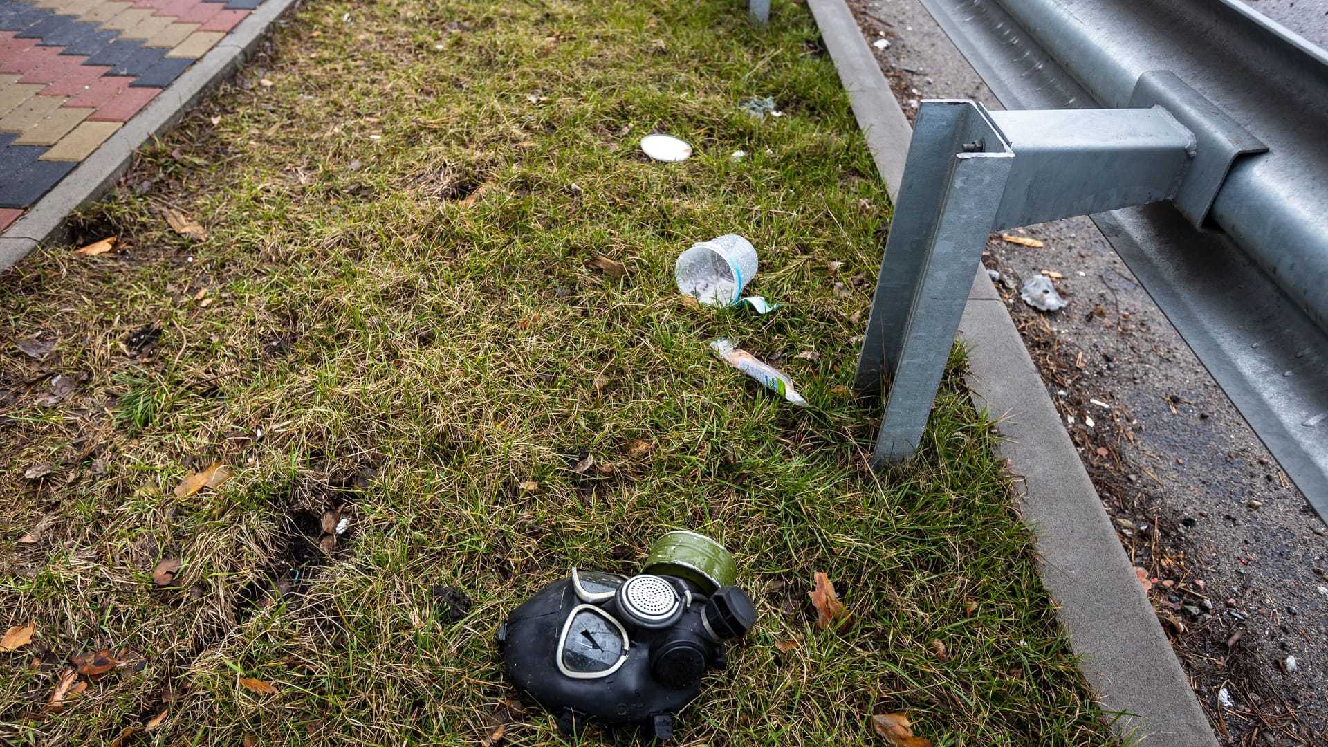 Hostomel, Kyev region Ukraine - 09.04.2022: Cities of Ukraine after the Russian occupation. Gas mask on the ground with broken glass near the right eye. Shot eye. Irpin, Bucha, Gostomel.