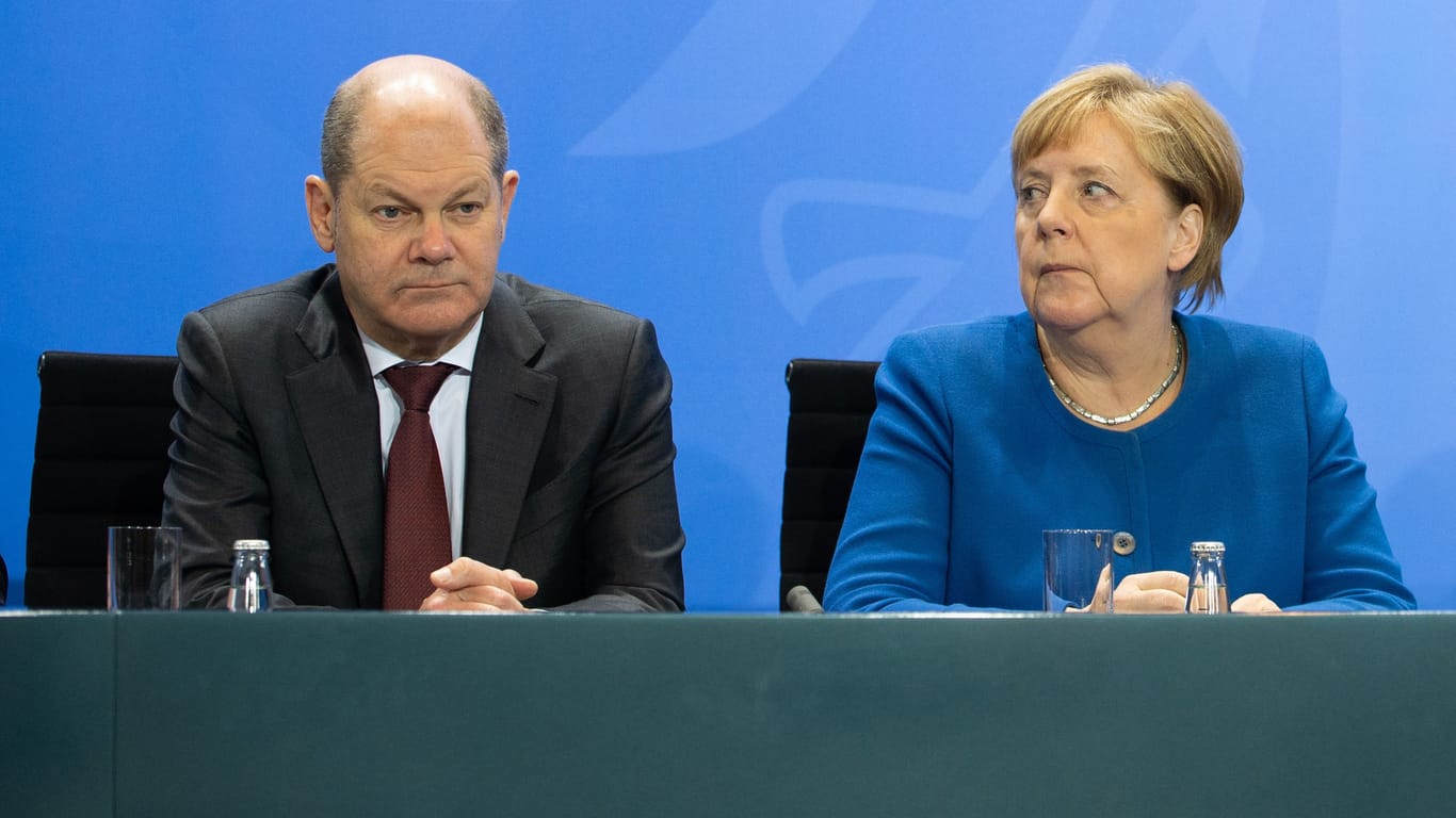 Olaf Scholz und Angela Merkel mussten während der Großen Koalition notgedrungen zusammenarbeiten.