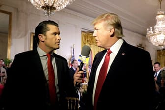 FILE PHOTO: U.S. President Donald Trump is interviewed by Fox and Friends co-host Pete Hegseth at the White House in Washington