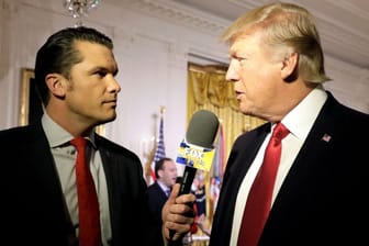 FILE PHOTO: U.S. President Donald Trump is interviewed by Fox and Friends co-host Pete Hegseth at the White House in Washington