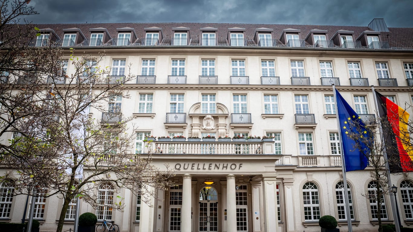 AACHEN, GERMANY - NOVEMBER 7, 2022: Quellenhof hotel entrance with a focus on its signage. Quellenhof is a luxury hotel and restaurant, part of the Bad aachen thermal spa complex and resort