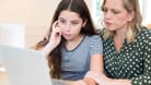 Mother Comforting Daughter Victimized By Online Bullying