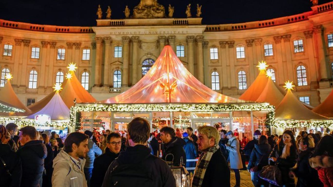 People visit the recently opened Christmas market on the Gendarmenmarkt in Berlin, Germany, November 25, 2024.