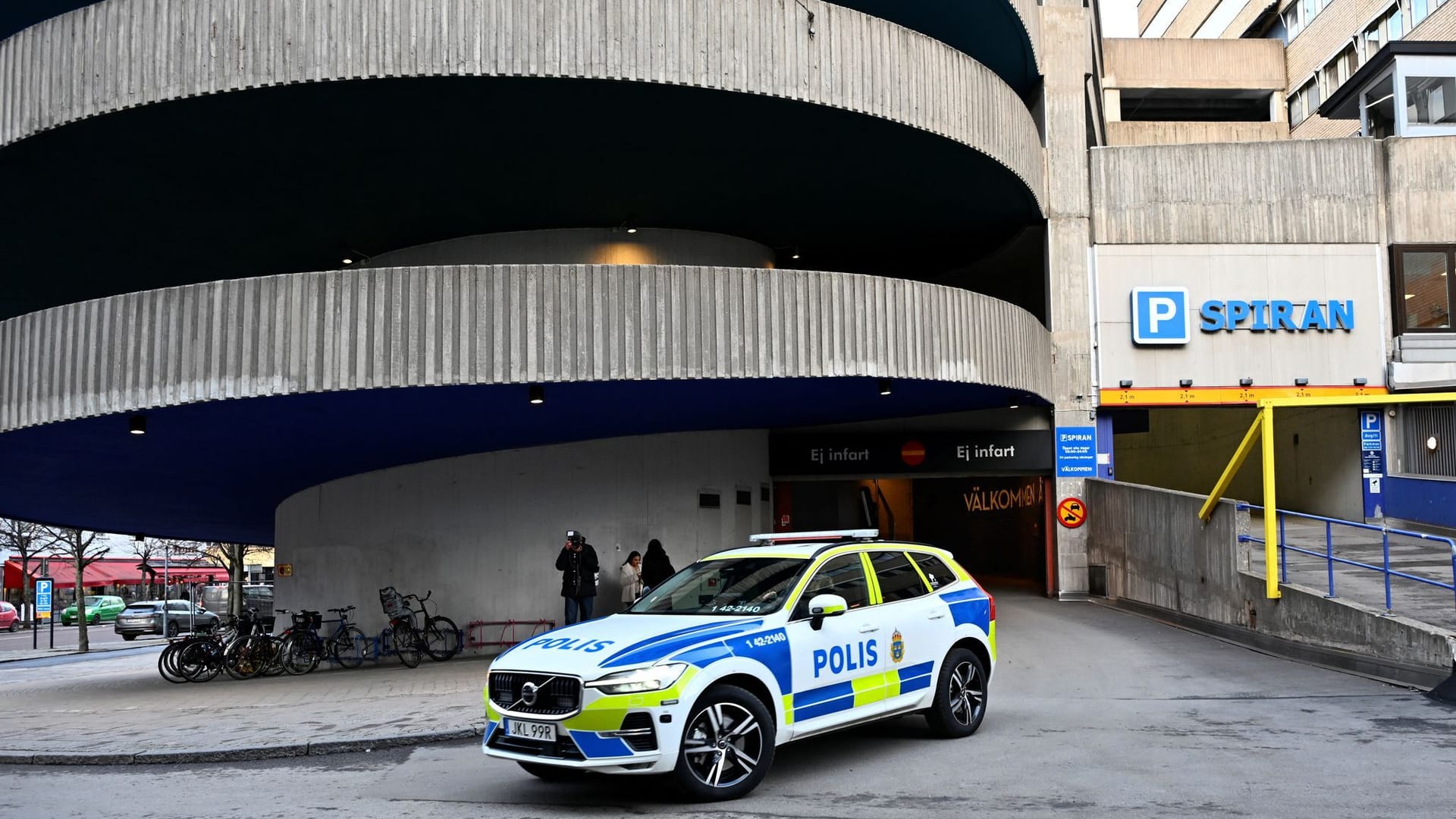 A police car stands near a parking garage where rapper Gaboro was shot dead on Thursday evening, in central Norrkoping