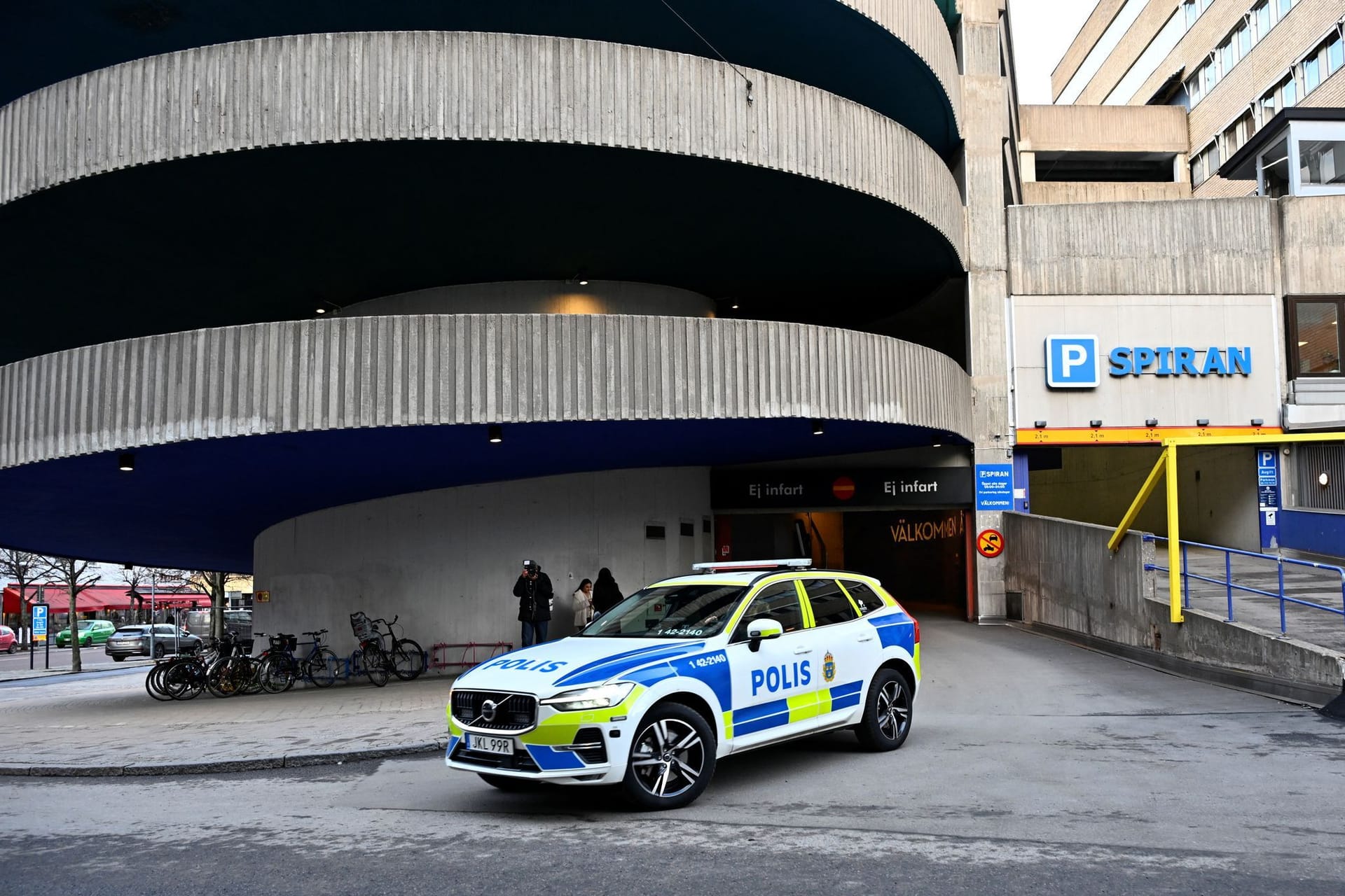 A police car stands near a parking garage where rapper Gaboro was shot dead on Thursday evening, in central Norrkoping