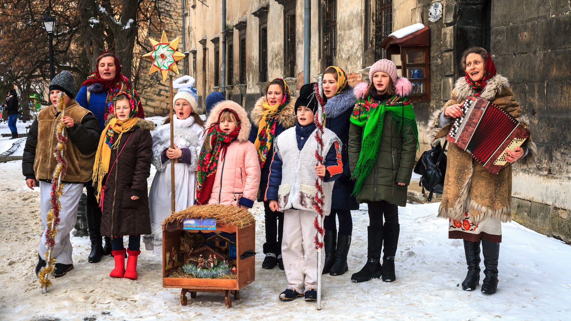 Group of children and adults singing Christmas carols in Lviv, Ukraine