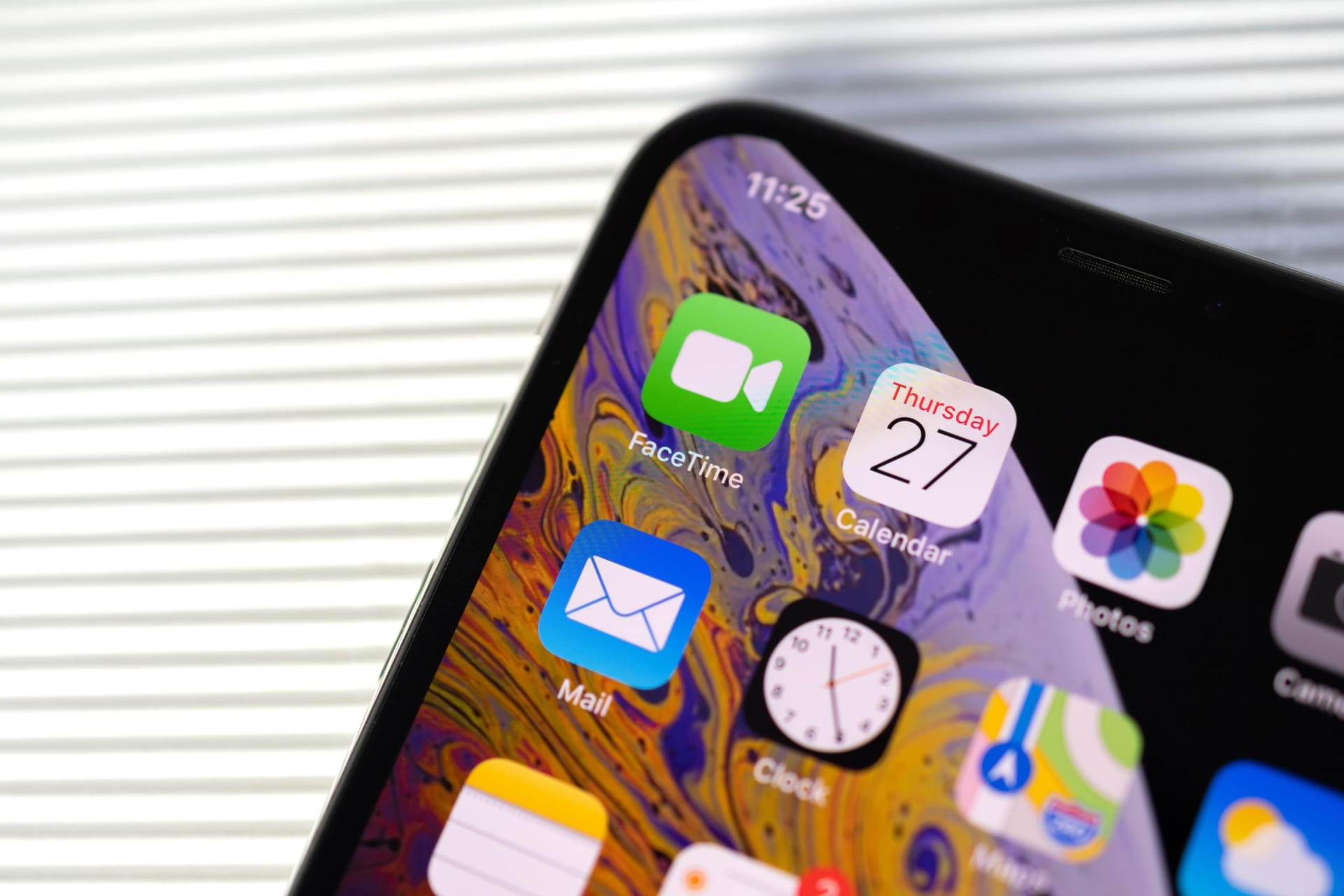 New iphone Xs Max with all home apps white background,