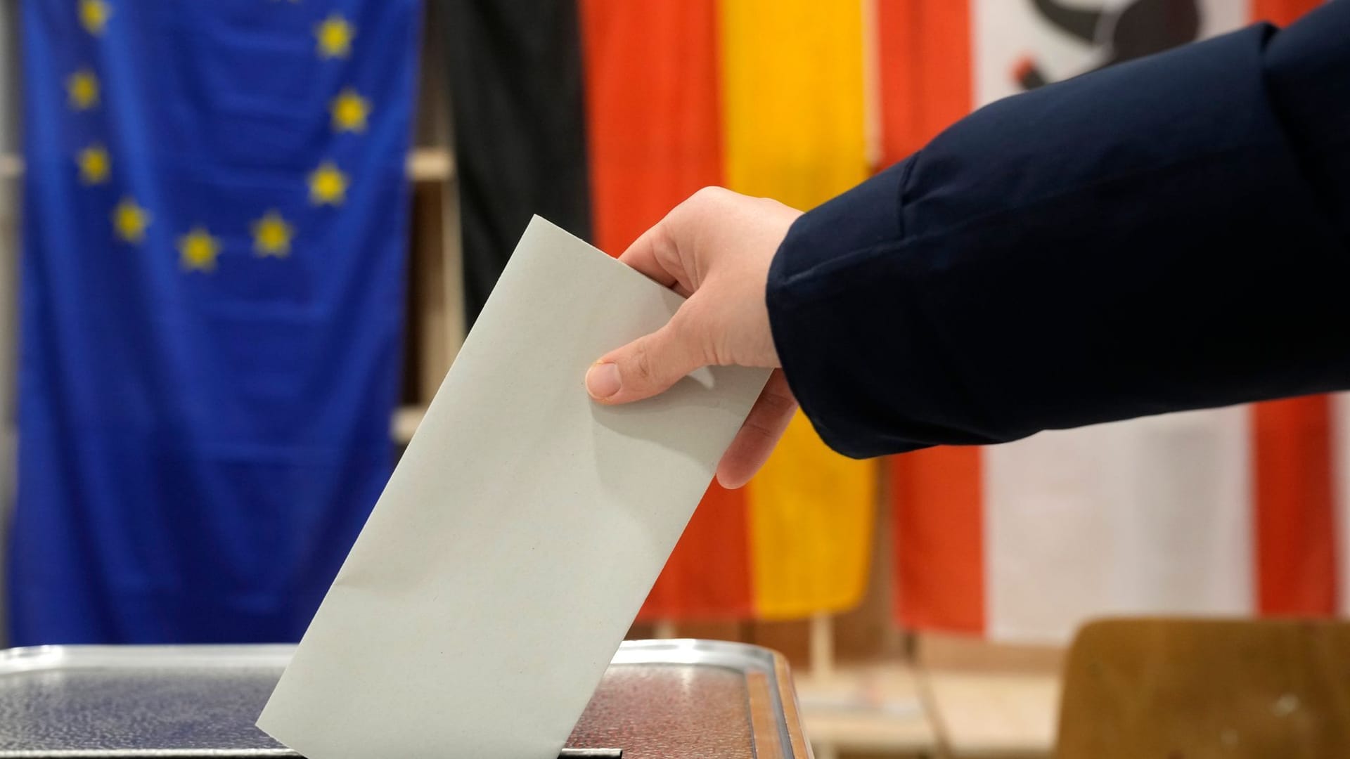 A resident casts a vote at a polling station in Berlin, Germany, Sunday, Feb. 23, 2025, during the German national election.