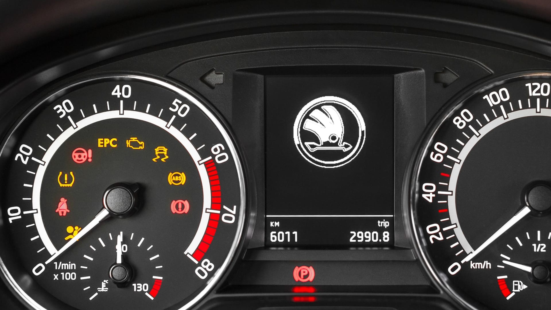 PRAGUE, CZECH REPUBLIC - JUNE 7, 2019: Close up image of illuminated car Skoda Rapid Monte Carlo dashboard panel with tachometer and speedometer