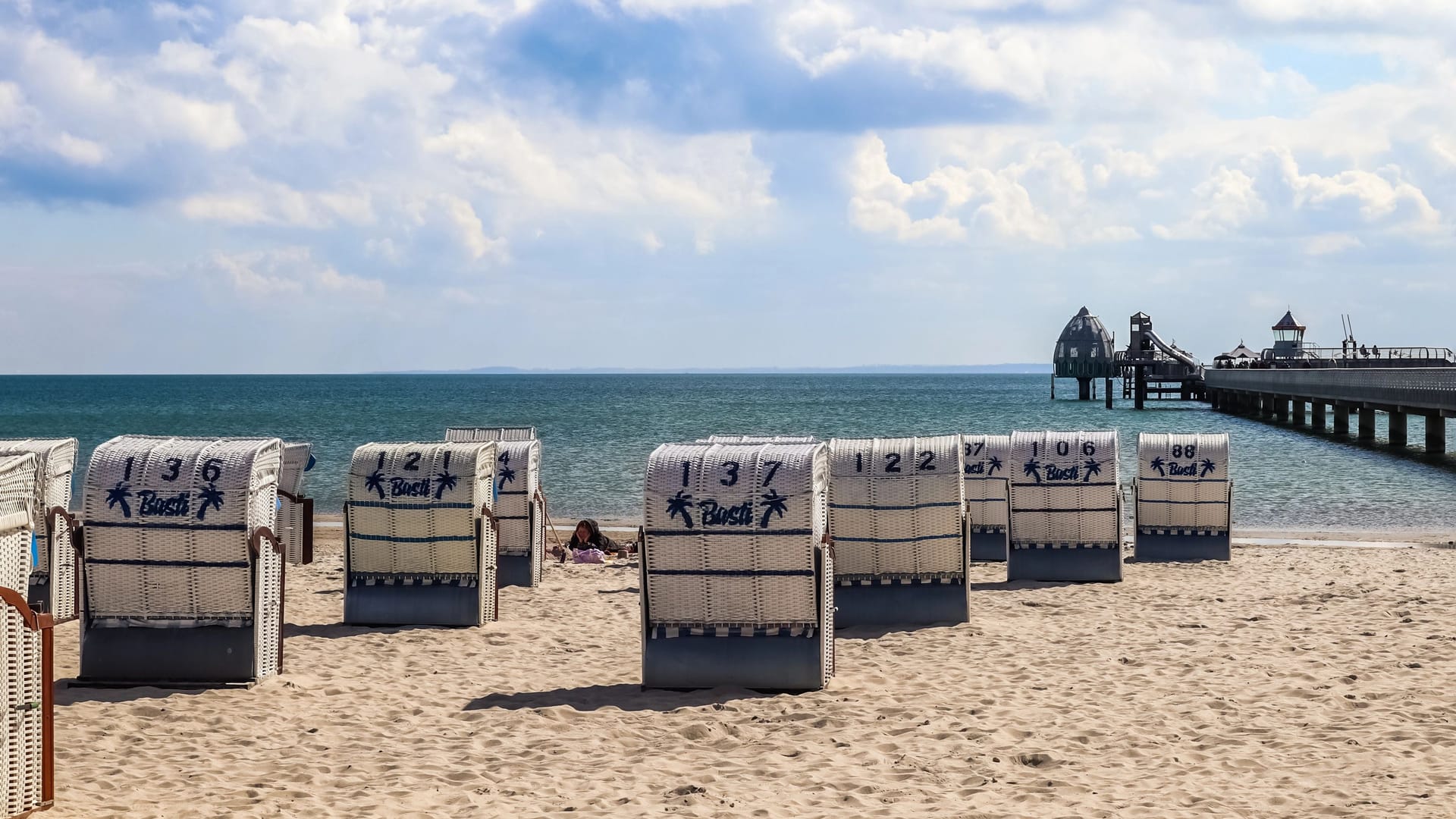 Groemitz, Germany - 05. April 2023: On the beach of Groemitz in northern Germany in sunny weather. Groemitz, Germany - 05. April 2023: On the beach of Groemitz in northern Germany in sunny weather.
