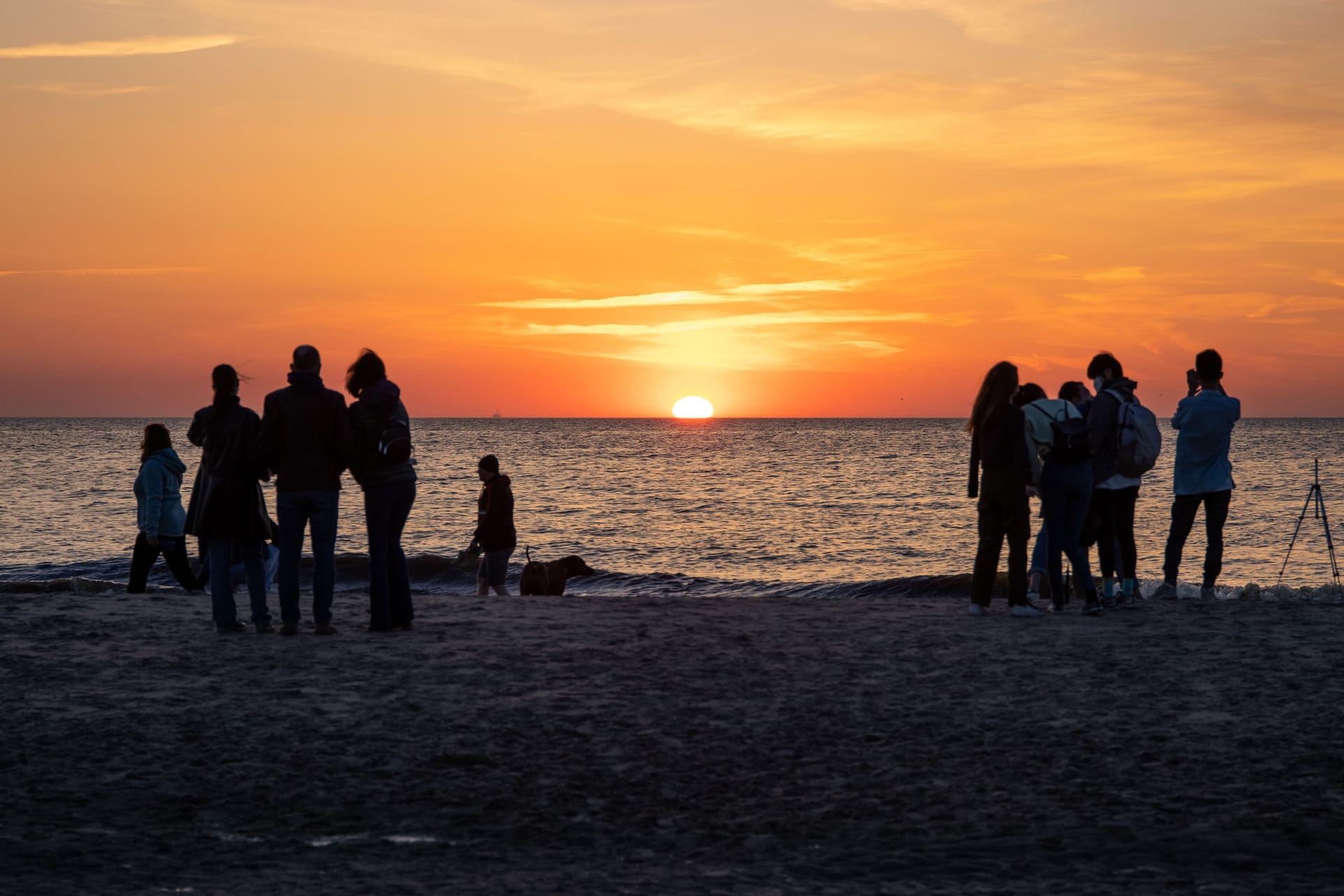 View of people watching a sunset in Noordwijk