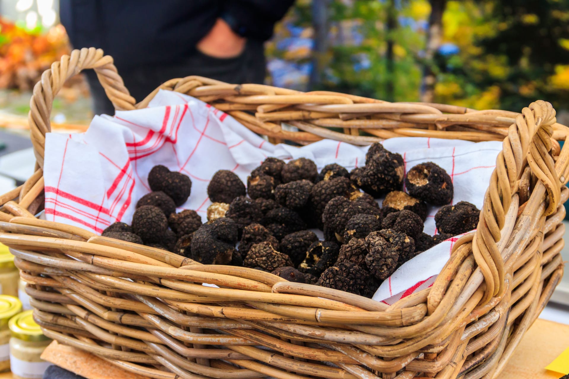 Expensive black truffles gourmet mushrooms in basket