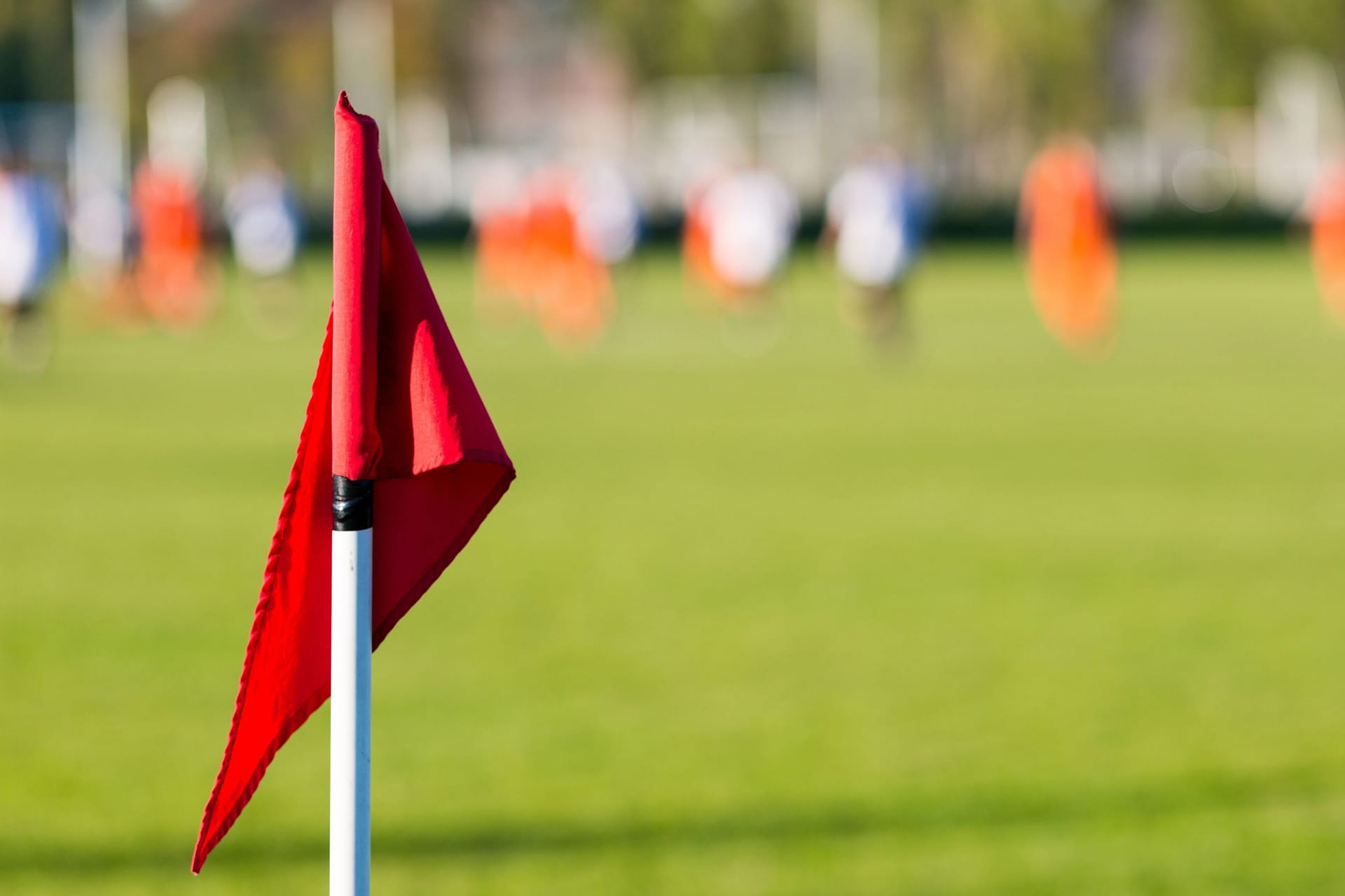 Blurred soccer players playing amateur soccer match