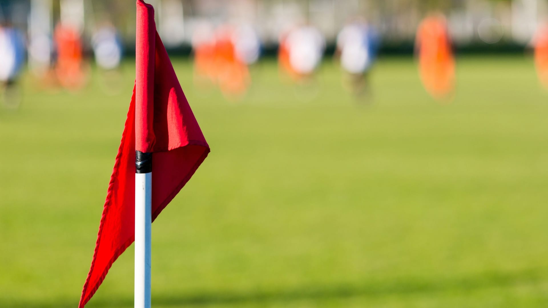 Blurred soccer players playing amateur soccer match
