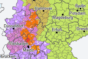 Wetterwarnkarte für Deutschland: Gefährliche Gewitterfront zieht über den Südwesten des Landes (in Rot und Orange). In Lila sind Gebiete gekennzeichnet, für die eine Hitzewarnung gilt.