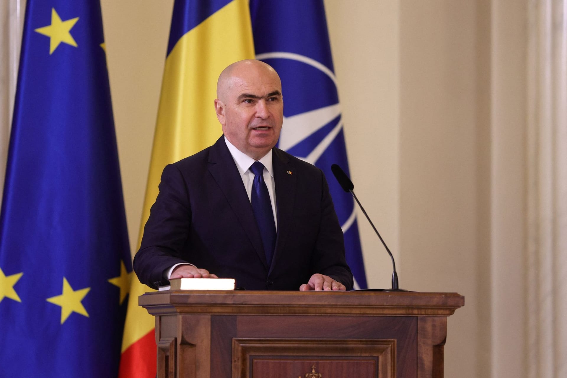 Romania's Prime Minister Bolojan speaks during a swearing in ceremony in Bucharest