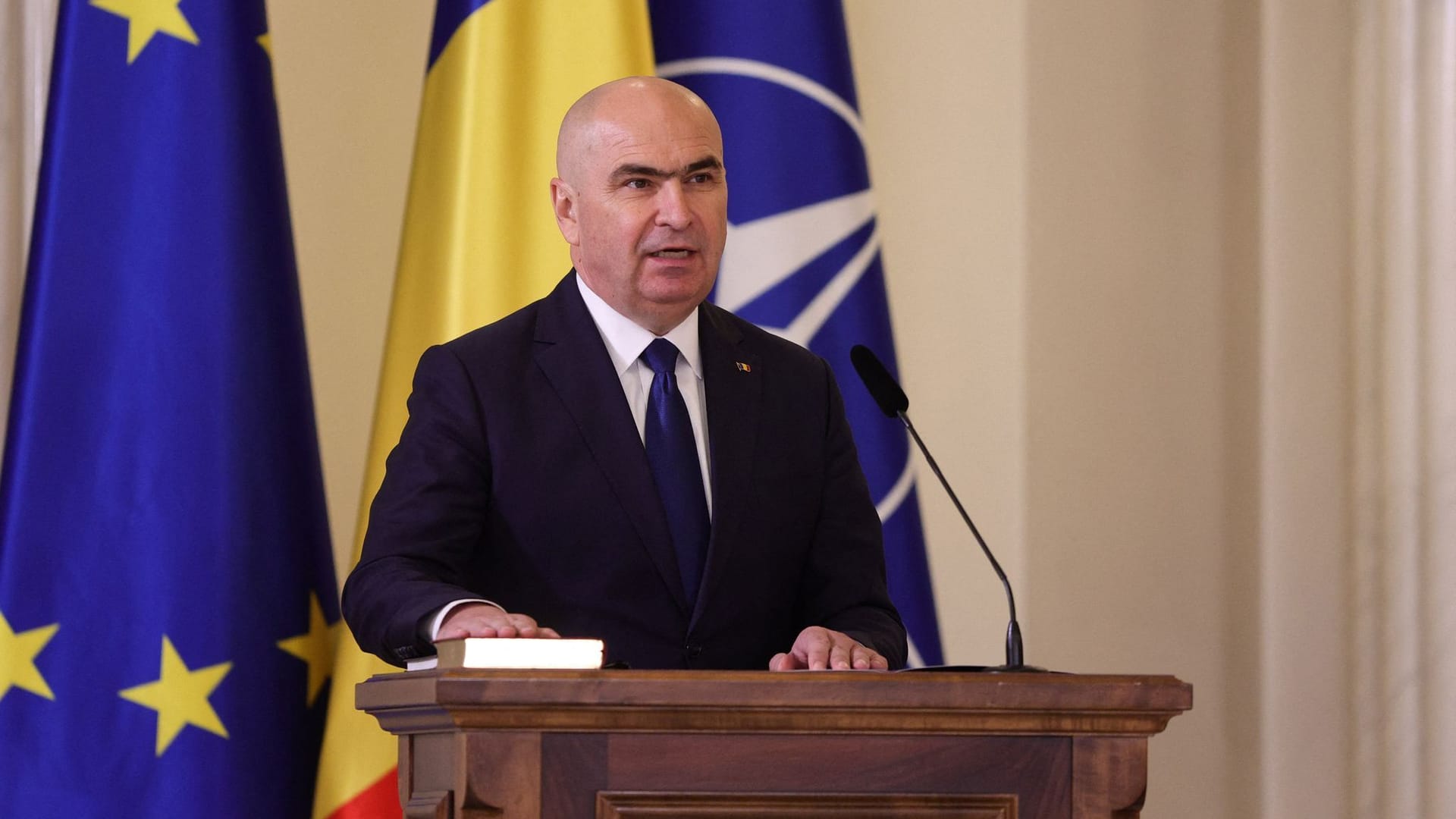 Romania's Prime Minister Bolojan speaks during a swearing in ceremony in Bucharest