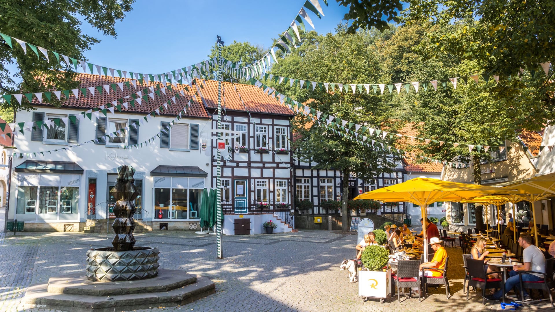 People at a cafe on the central square of Tecklenburg
