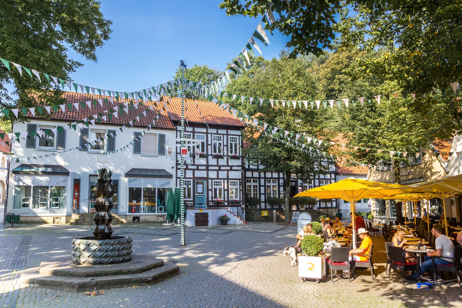 People at a cafe on the central square of Tecklenburg