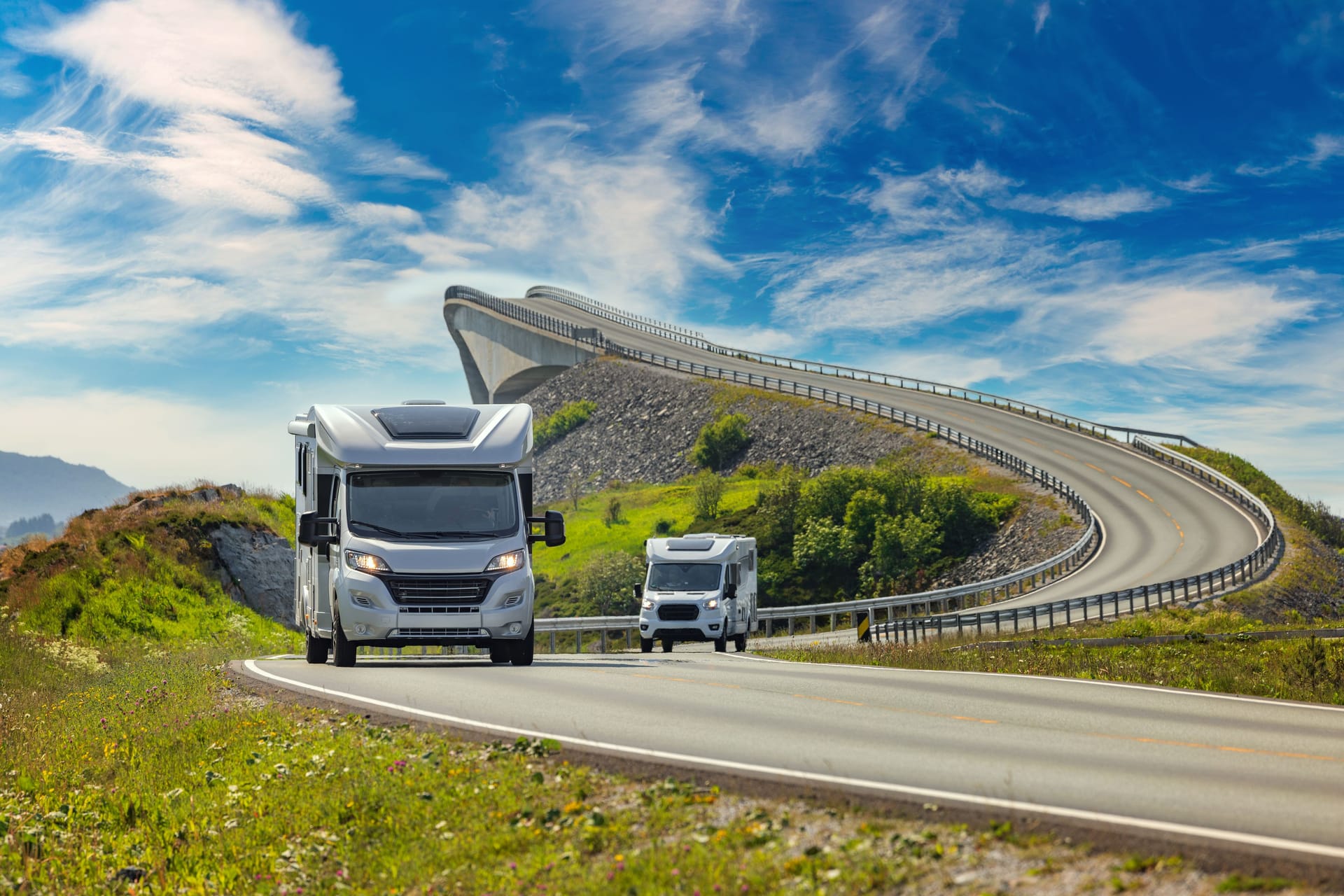 Caravan car RV travels on the highway Atlantic Ocean Road Norway.