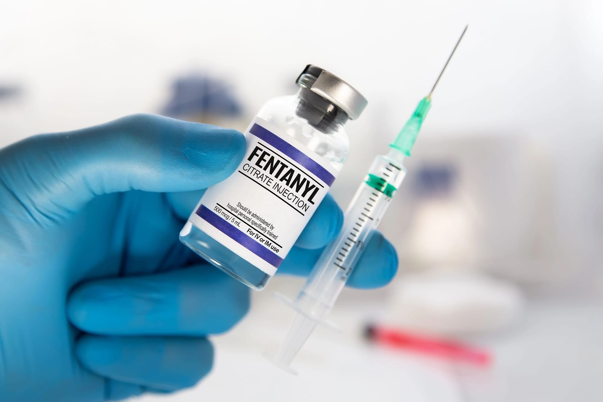 Doctor holding medical injection of medication of Fentanyl is Opiod used to palliate pain or for anesthetic Doctor holding medical injection of medication of Fentanyl is Opiod used to palliate pain or for anesthetic