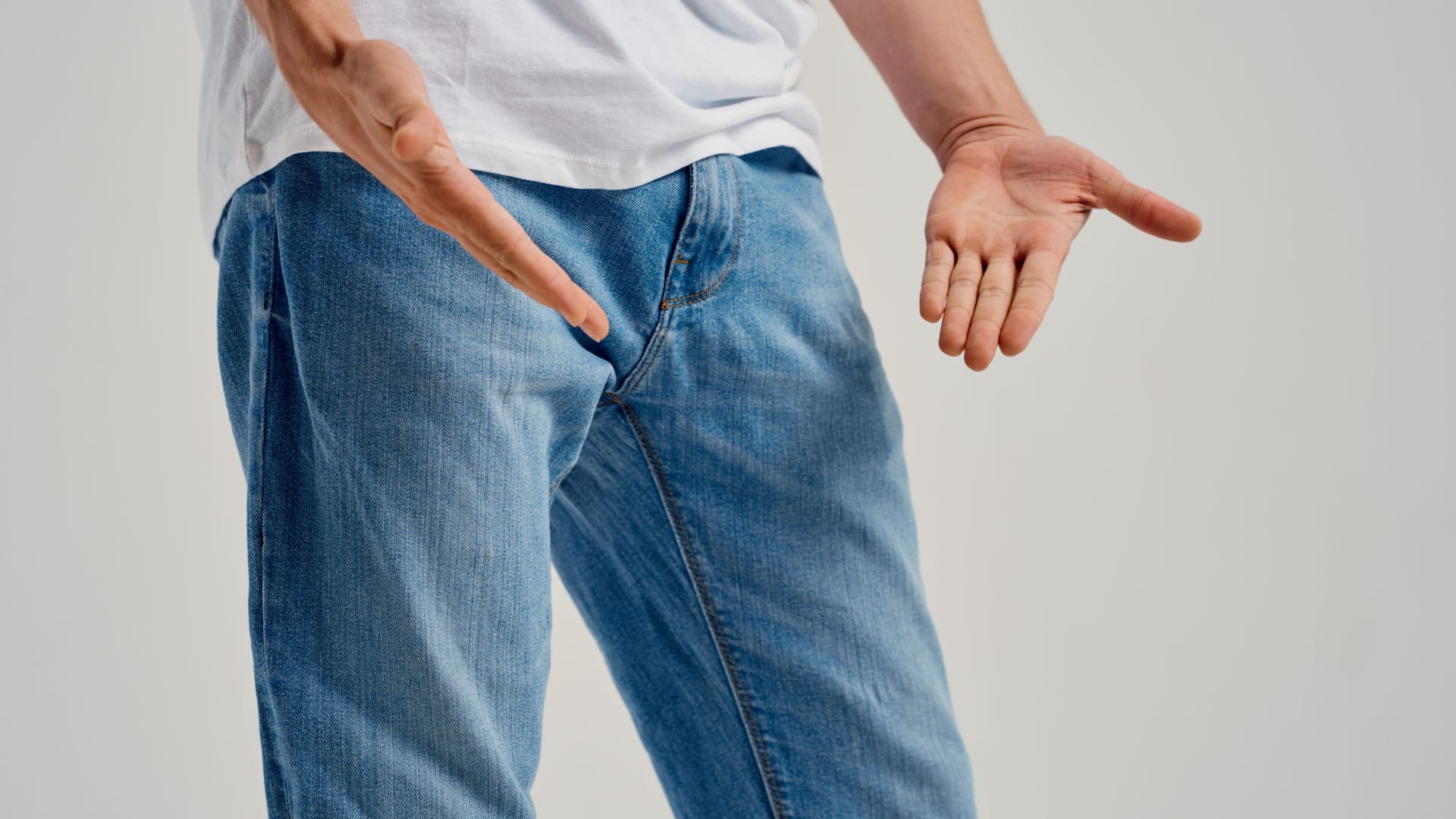 man showing negative gesture with hand problems with genitals