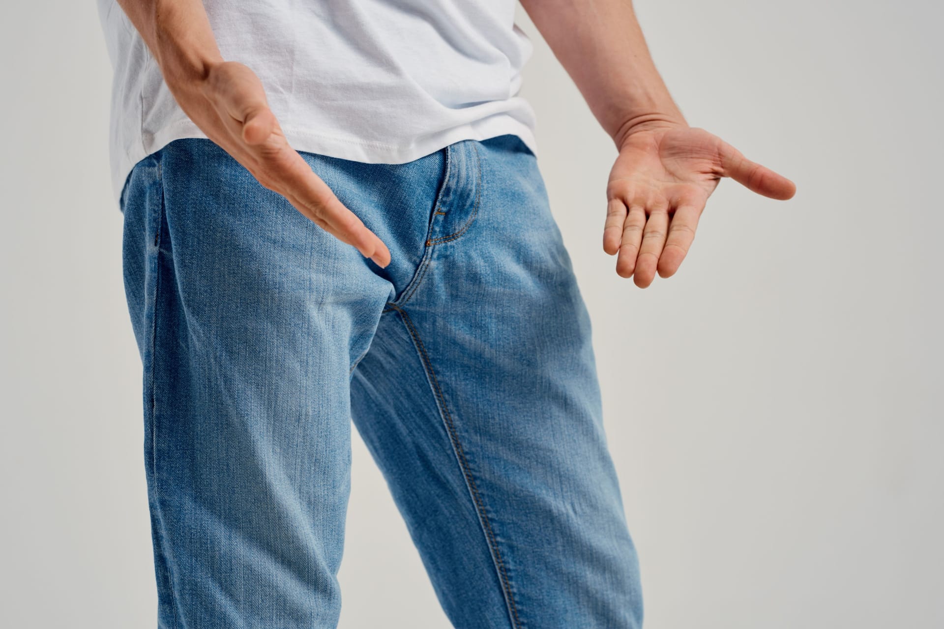 man showing negative gesture with hand problems with genitals