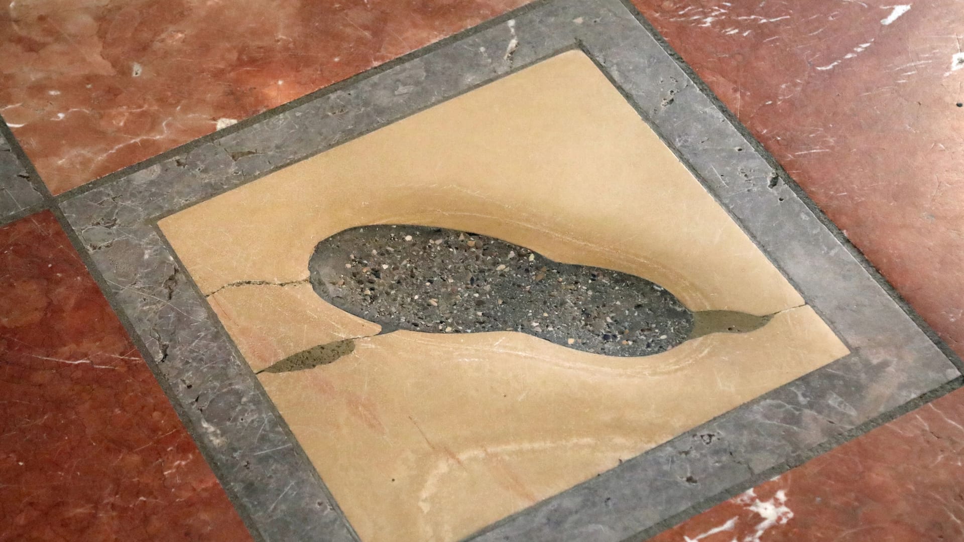 Munich, Munich, Germany - August 26, 2021: At Entrance of Cathedral there is the Devil s Footstep also called Teufelstritt in German Language