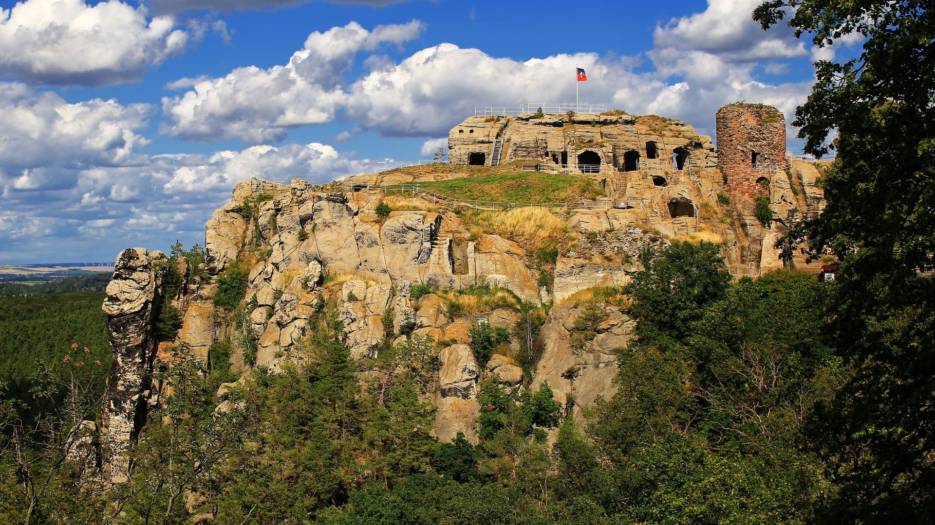 Regenstein castle ruin in Germany, seen as in the famous Merianblick/Merian view Regenstein castle ruin in Germany, seen as in the famous Merianblick/Merian view