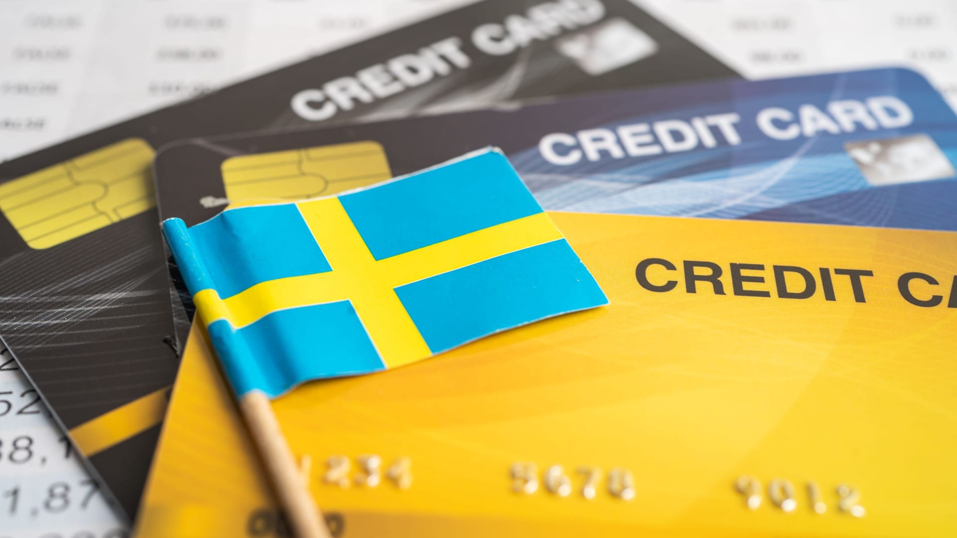 Credit card model with Sweden flag, financial investment economy business banking concept. Credit card model with Sweden flag, financial investment economy business banking concept.