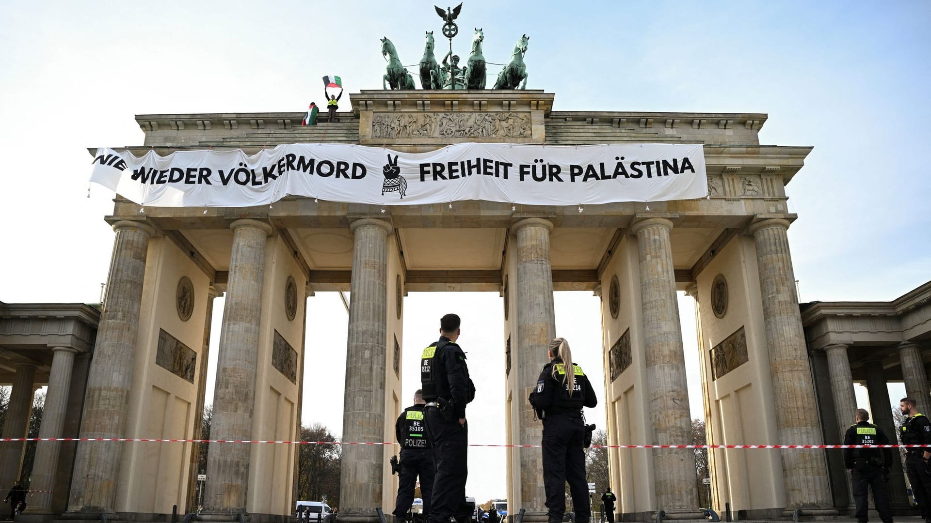 Pro-Palestinian activists protest atop of Berlin landmark Brandenburg Gate Pro-Palestinian activists protest atop of Berlin landmark Brandenburg Gate